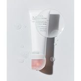 Tube of oil control cream on a light gray background