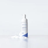 Skincare bottle with brand logo on a white background