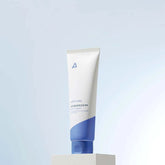 Tube of skincare product on a light gray background