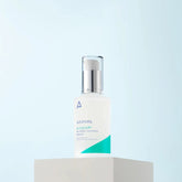 Skincare bottle on a light blue background
