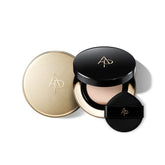 Makeup compact with black and gold lid on a white background