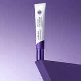 White and purple eye cream tube on a gradient purple background