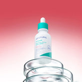 Skincare dropper bottle with a gradient red to pink background