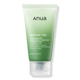 Green tube of Anua skincare product on a white background