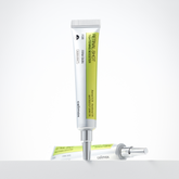 Skincare product with applicator on a white background