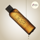 Amber bottle with black cap labeled 'Made for Me' by Axis-V, on a beige background.