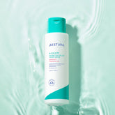 Aestura bottle on a light green background