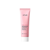 Pink tube of Anua sunscreen on a white background