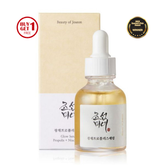 Beauty serum bottle with dropper and packaging on a white background
