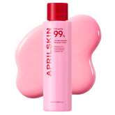 Pink skincare bottle with red cap on a white background