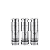 Three silver skincare bottles with a white background