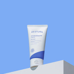 Aestura Atobarrier cream tube on a blue background