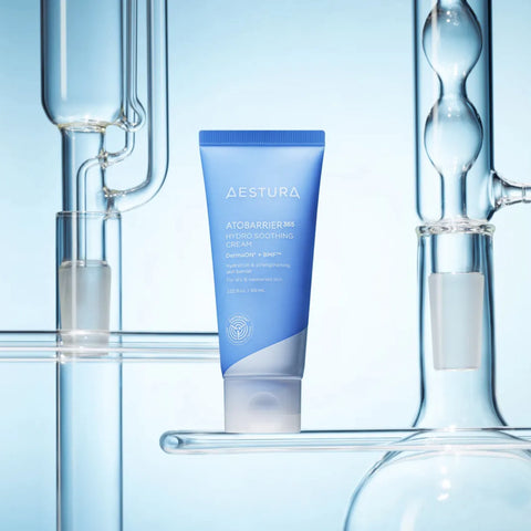 Aestura skincare tube with laboratory equipment in the background
