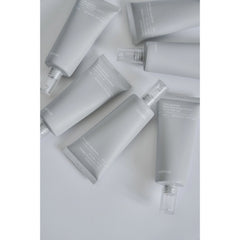 Collection of skincare products on a light gray background