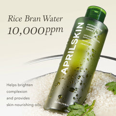 Green bottle of Aprilskin rice bran water toner with text on a light background