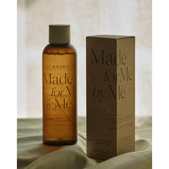 Amber bottle and box labeled 'Made for Me by Me' on a neutral background