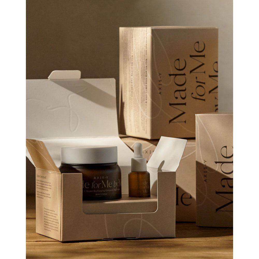 Arylie skincare products including a jar, bottle, and boxes on a wooden surface.