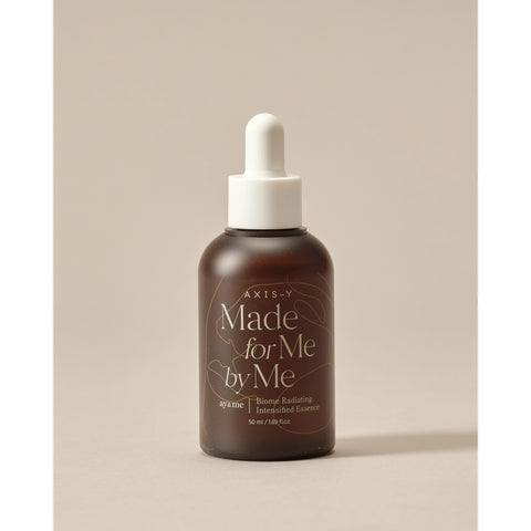 Bottle of AXIS-Y 'Made for Me by Me' on a beige background