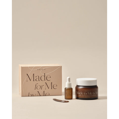 Skincare product set with 'Made for Me by Me' branding on a beige background