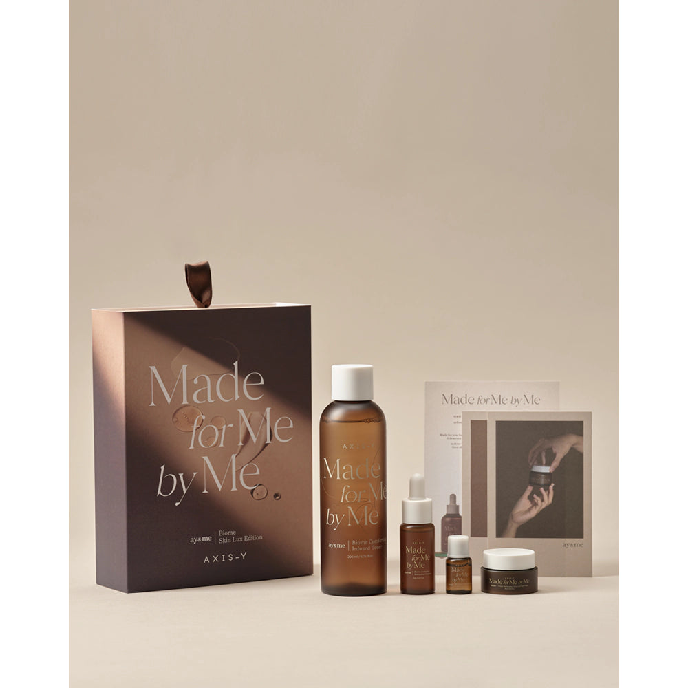 Cosmetic products and packaging with 'Made for Me by Me' branding on a neutral background