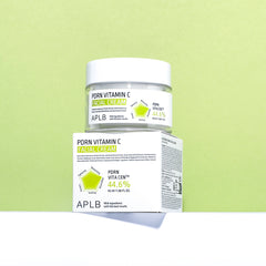 APLB Porn Vitamin C Facial Cream jar and box on a green background