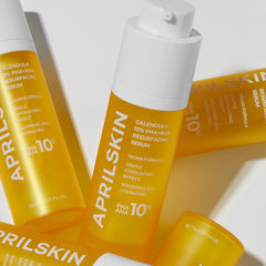 Multiple bottles of Aprilskin Calendula 10% PHA-AHA Resurfacing Serum on a light background