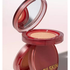 Open compact powder with visible brand name on a light pink background