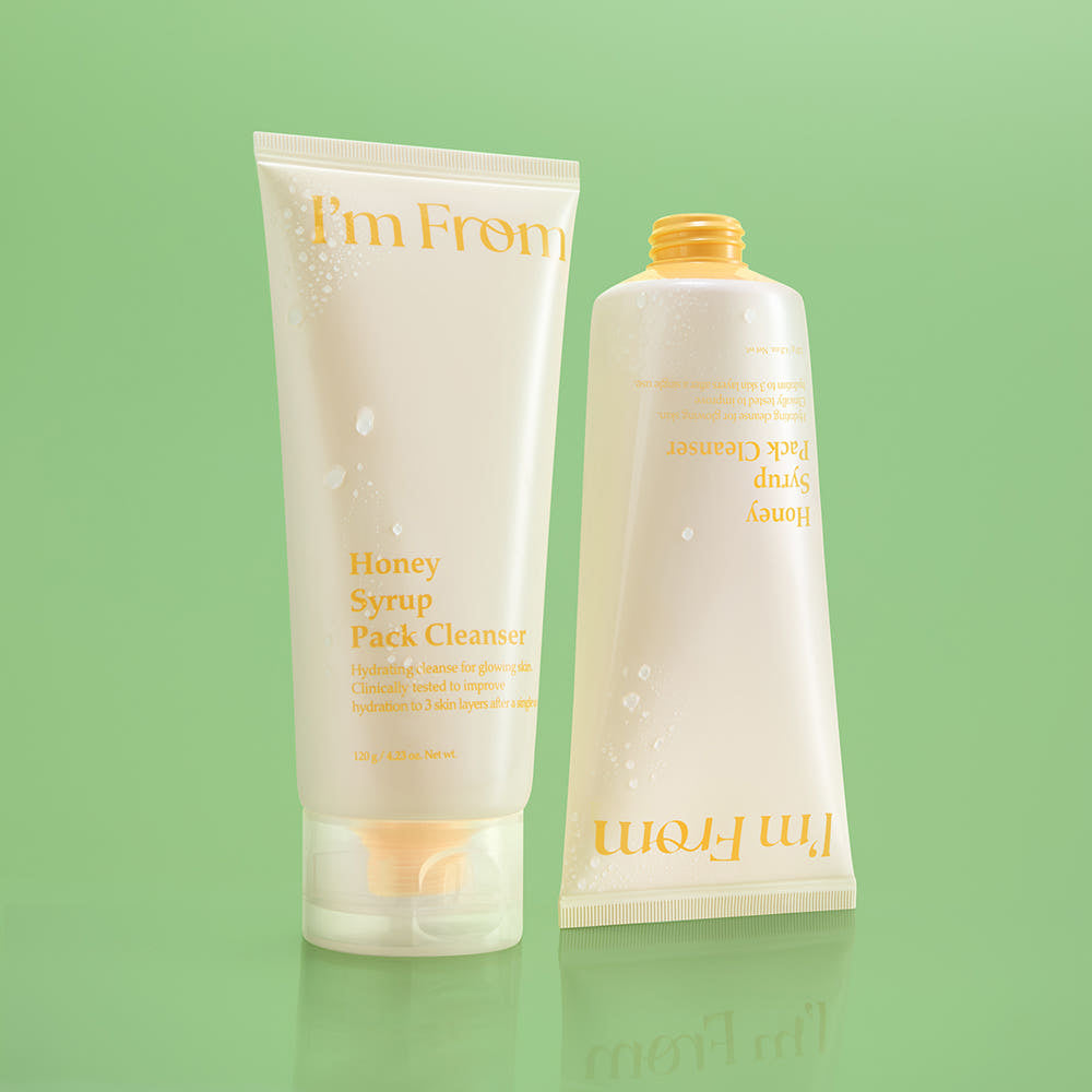 Two skincare products from 'I'm From' on a green background