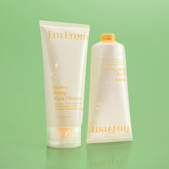 Two skincare products from 'I'm From' on a green background