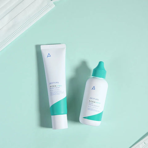 Two skincare products on a light green background