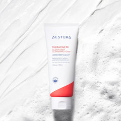 Aestura skincare product on a textured white background