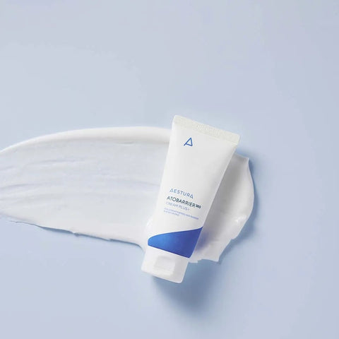 Tube of cream with a white applicator on a light blue background