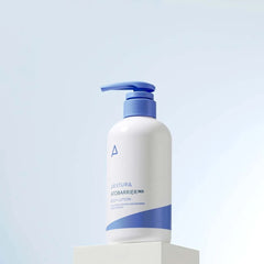 White bottle with blue pump on a light blue background