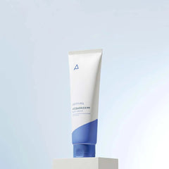 Tube of skincare product on a light gray background