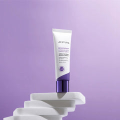 Tube of Neutrogena cream on a white stand against a purple background