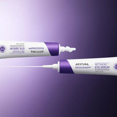 Two Aestura eye serum tubes on a gradient purple and black background