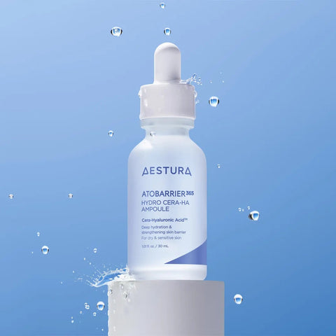 Aestura skincare serum bottle on a blue background