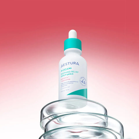 Skincare dropper bottle with a gradient red to pink background