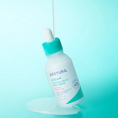 Aestura skincare bottle with dropper on a light blue background