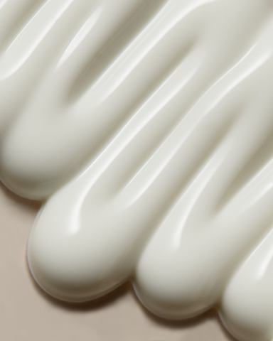 Close-up of white ceramic spoons with a smooth texture.