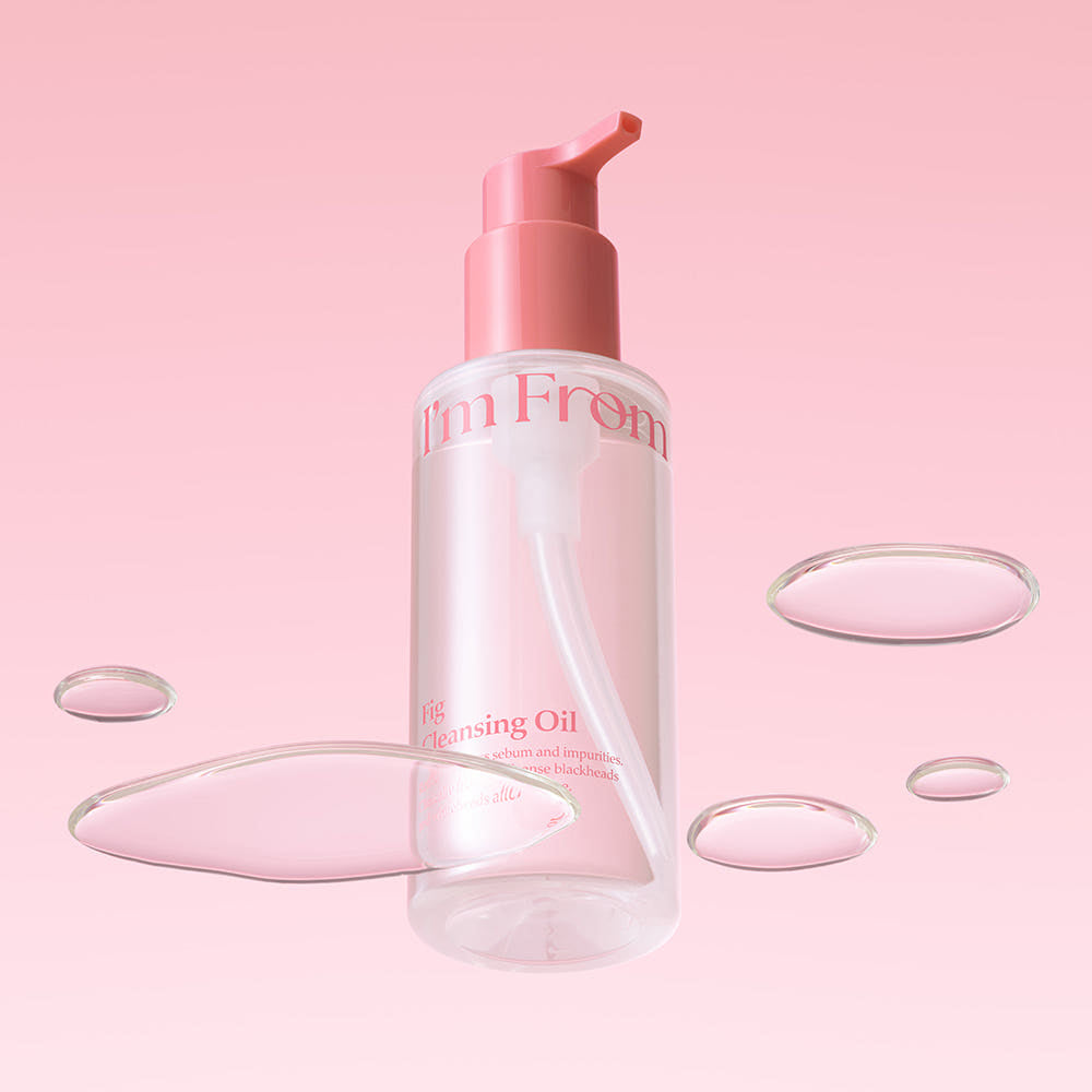 Skincare bottle with pink pump on a pink background