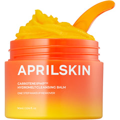 Aprilskin cleansing balm jar with yellow cream and orange lid on a white background
