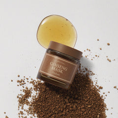 Ginseng mask jar with a spoonful of mask on a light gray background