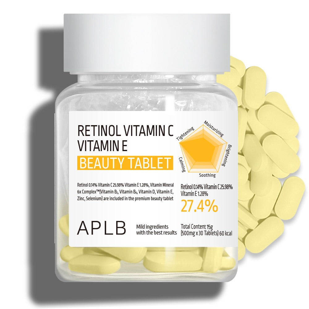 Bottle of Retinol Vitamin C and Vitamin E beauty tablets with scattered tablets on a white background