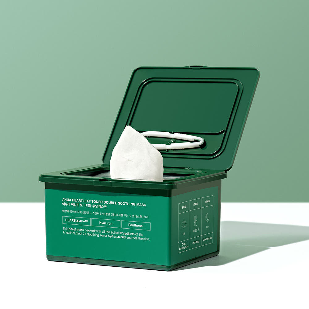 Green mask box with a white mask inside on a light green background