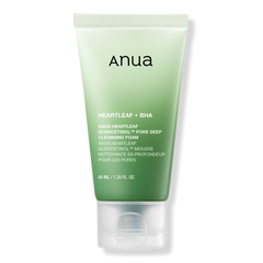 Green tube of Anua skincare product on a white background