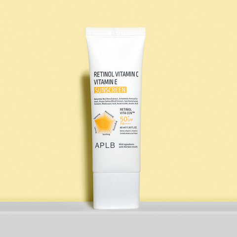 Tube of APLB Retinol Vitamin C Vitamin E Sunscreen on a light yellow background
