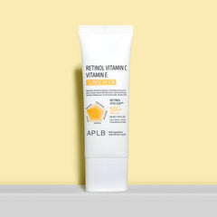 Tube of APLB Retinol Vitamin C Vitamin E Sunscreen on a light yellow background