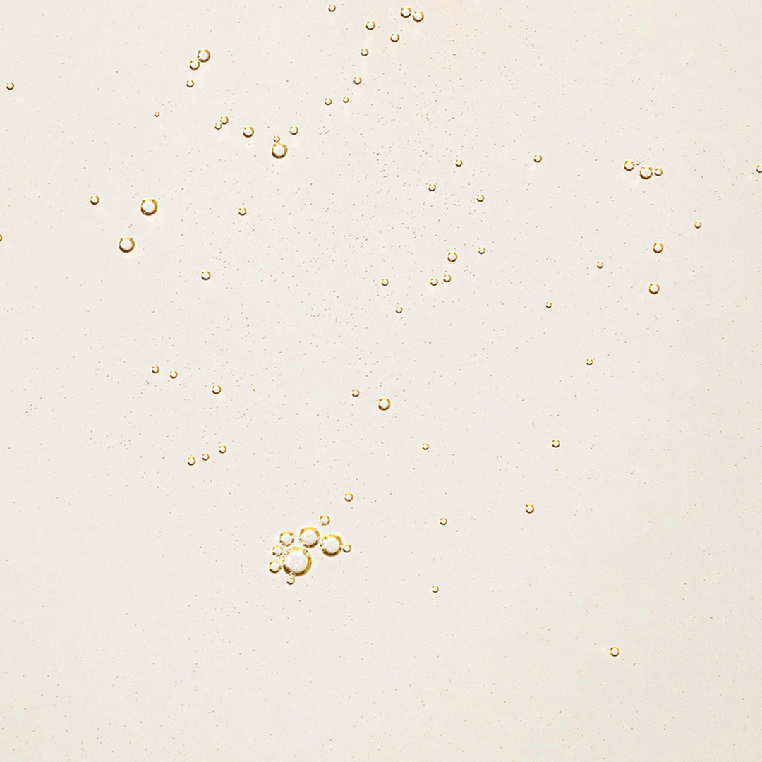 Gold bubbles on a beige background