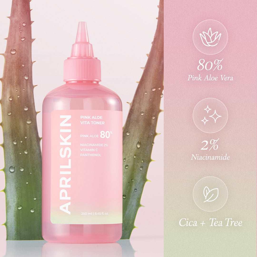 Pink skincare bottle with aloe vera leaves and product packaging on a light pink background